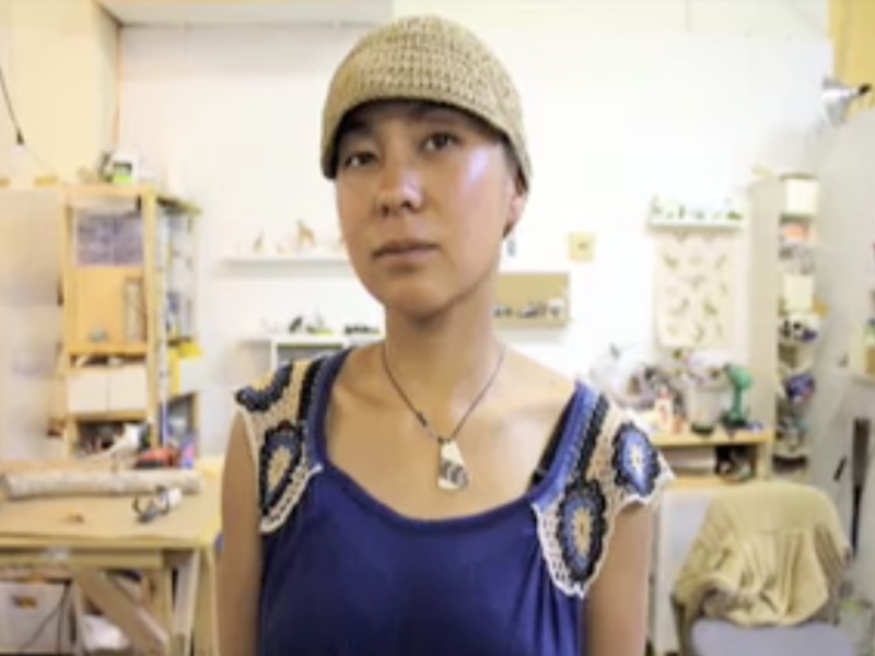 A woman in her kitchen