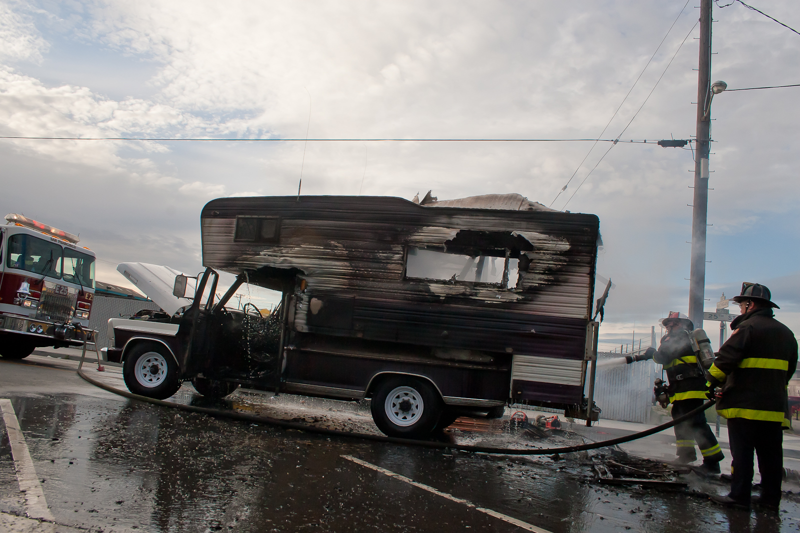 Firefighters put out the last of a fire set to a vehicle at 25th and Michigan.