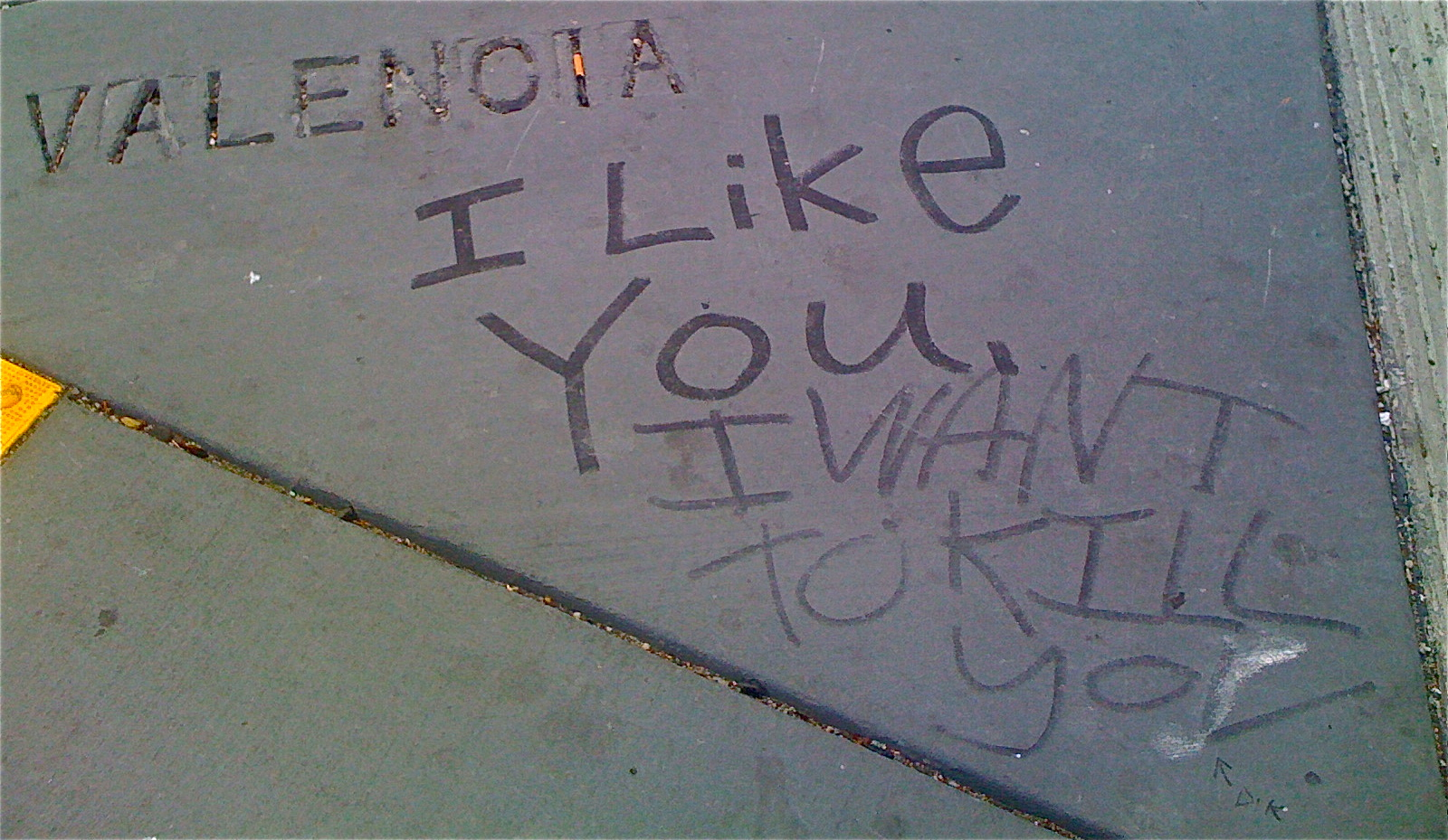 Sidewalk graffiti on the corner of 14th and Valencia Streets.