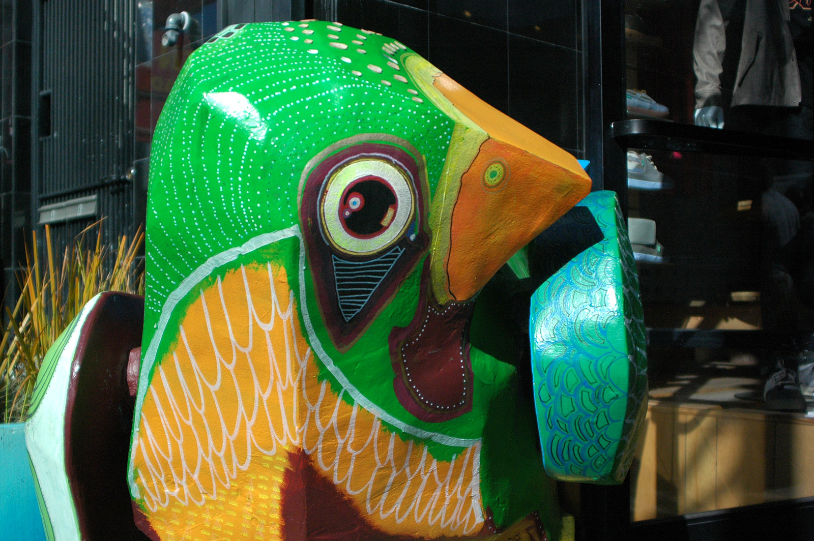 Picture shows a multicolored bird sculpture.