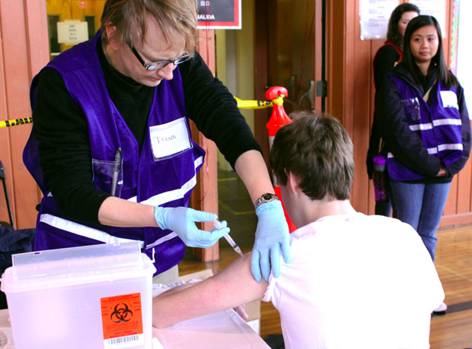 Kid gets a Tdap booster at a free Vaccine clinic at Roosevelt Middle School, San Francisco, in March of 2011
