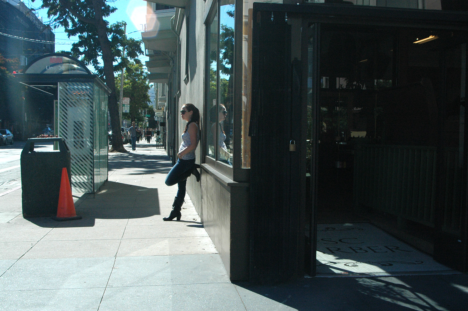 Image shows a woman on her street with her leg up.