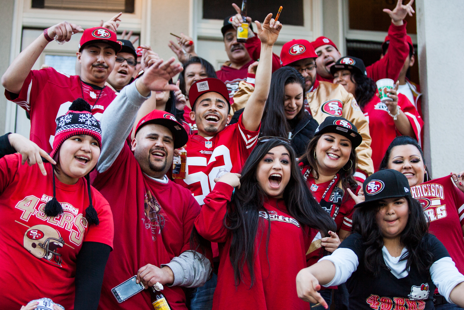 Family screams in excitement on their front steps