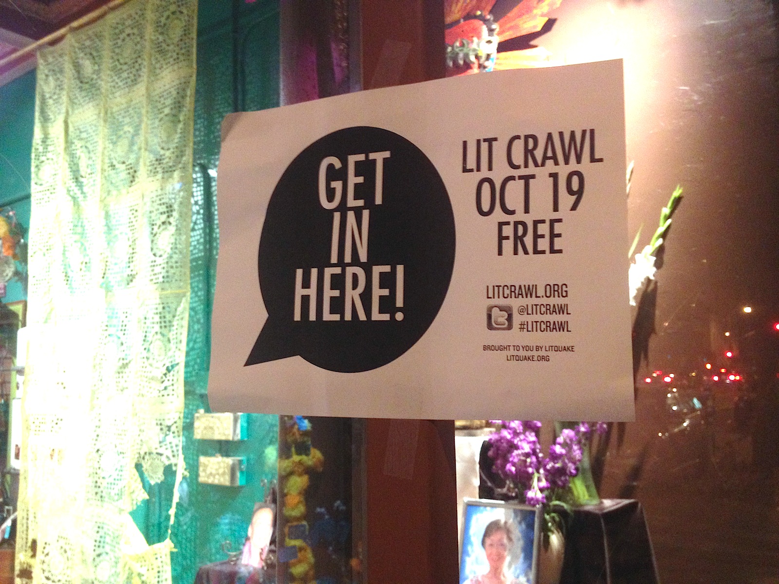Sign that reads "get in here!" for Lit Crawl.
