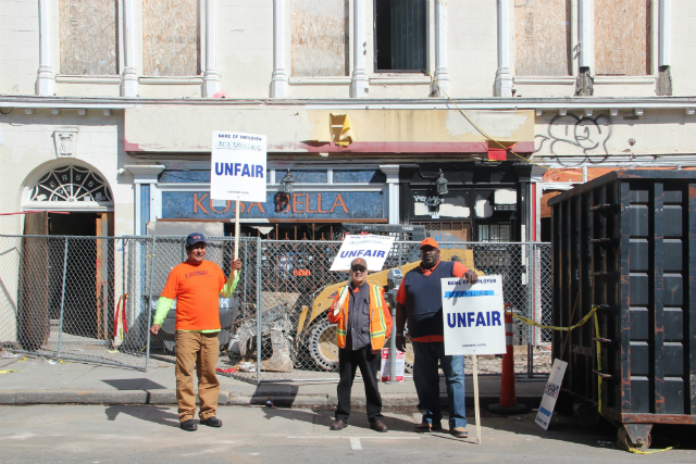 Picketers from Local 261 outside the Mission and 22nd building on Thursday. Photo by Joe Rivano Barros.