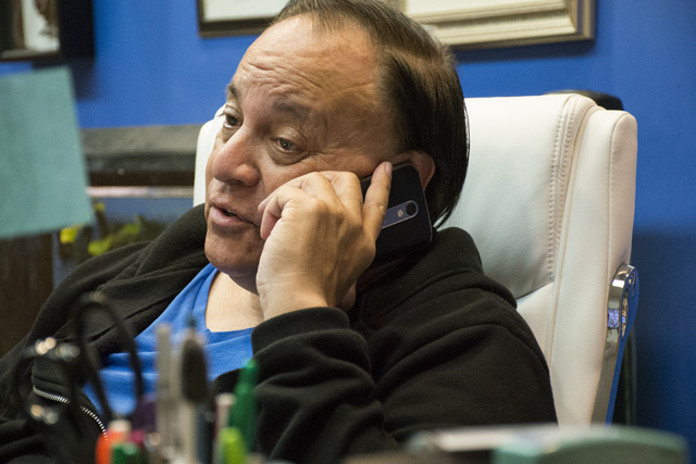 Leonard Lacayo sits in his office.