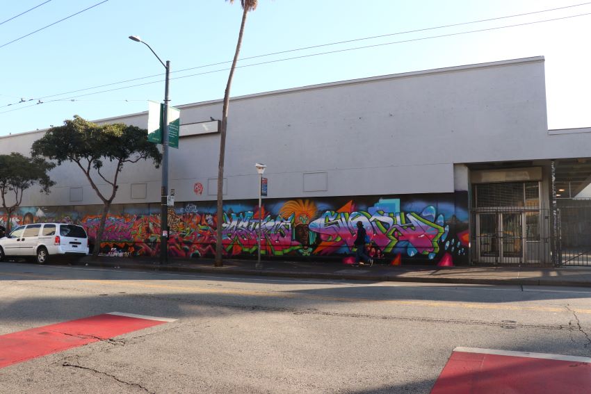 An affordable housing building with graffiti.