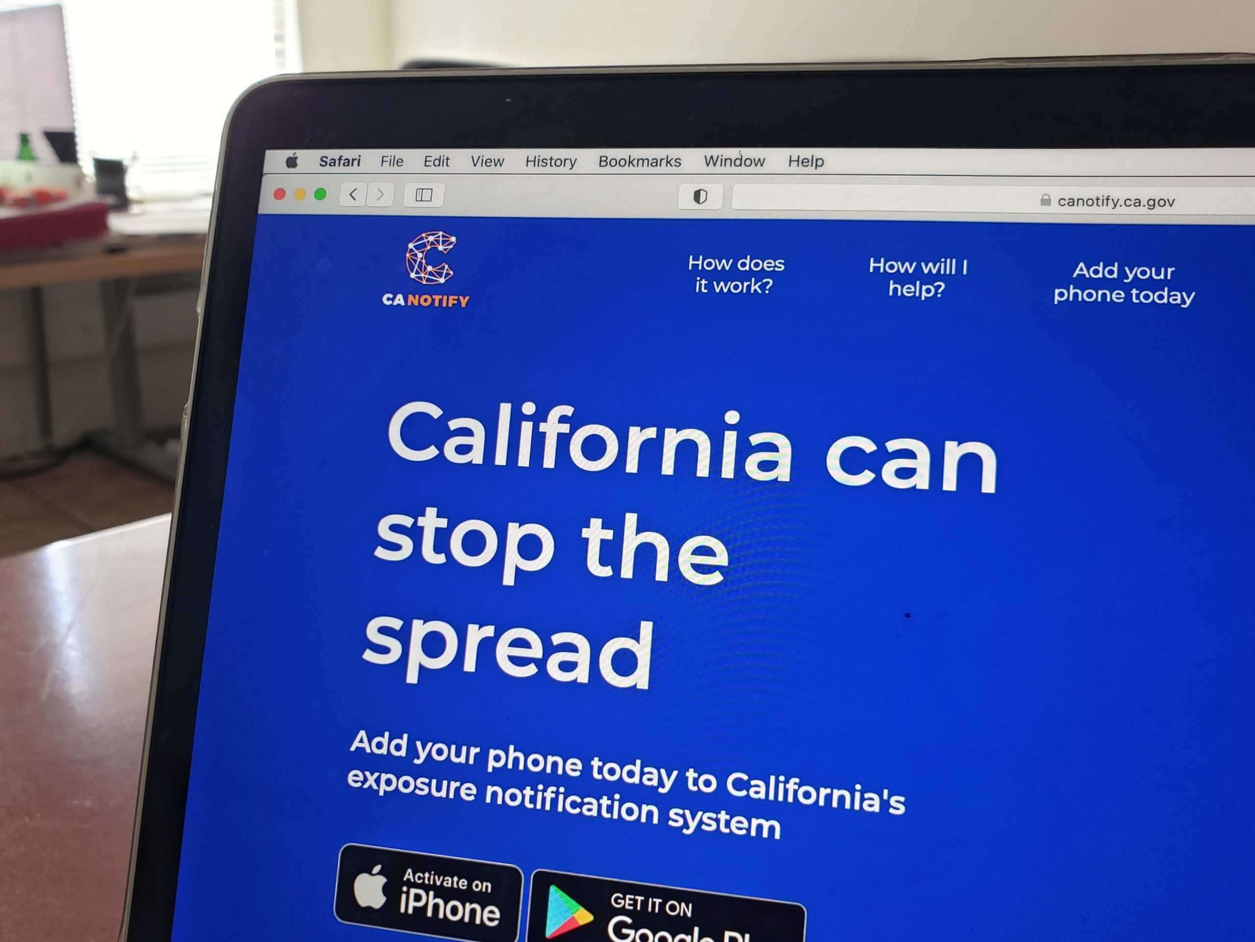 CA Notify's website on a laptop. Mission Local. April 2021.