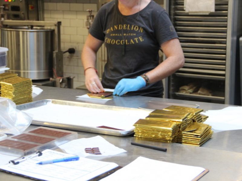 The chocolate is hand-wrapped in golden foil before being machine-wrapped in specially-made Indian paper. After that, it's labeled and sent out to retailers nationally and internationally. Photo by Joe Rivano Barros.