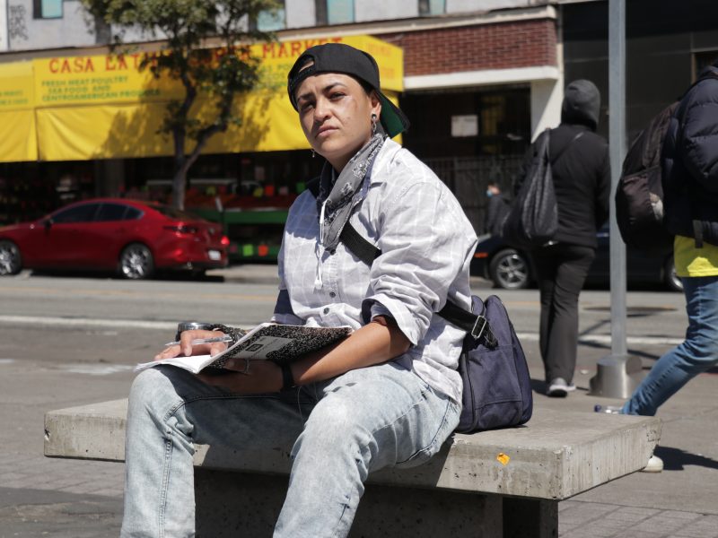 Herlinda Huerta sits at a bench at the 16th and Mission streets BART Station