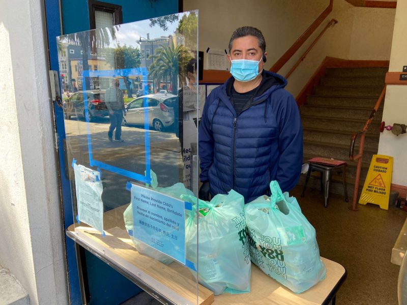 Essential worker Jorge Mancera at the Mission High School food pantry for SFUSD.