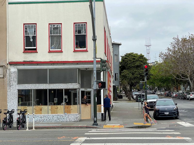 Rory Lydon at his Lucca door talking to someone on the street.