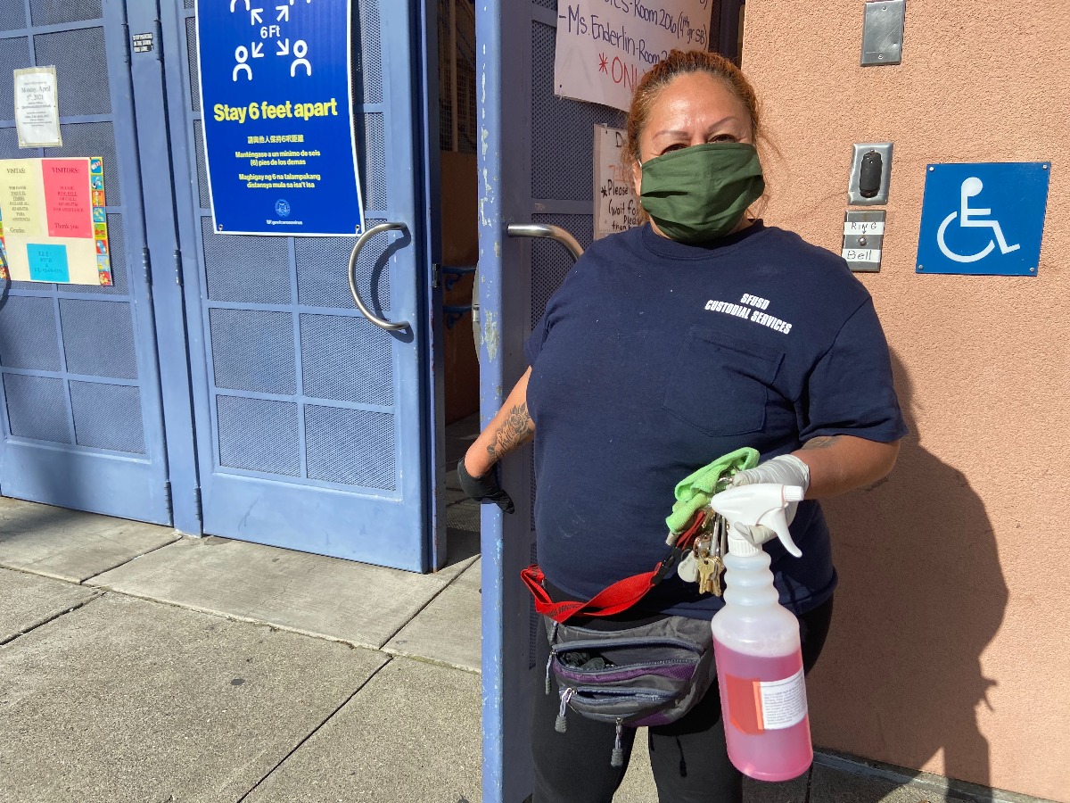FIRST DAY OF SCHOOL, SAN FRANCISCO: Patty Serbellon a custodian for the San Francisco Unifed School District, was so excited to be back to work and see the children at George Moscone Elementary School. Photo by Clara-Sophia Daly. Custodians and other staff members were so excited to be back to in-person learning after more than a year of school closings.