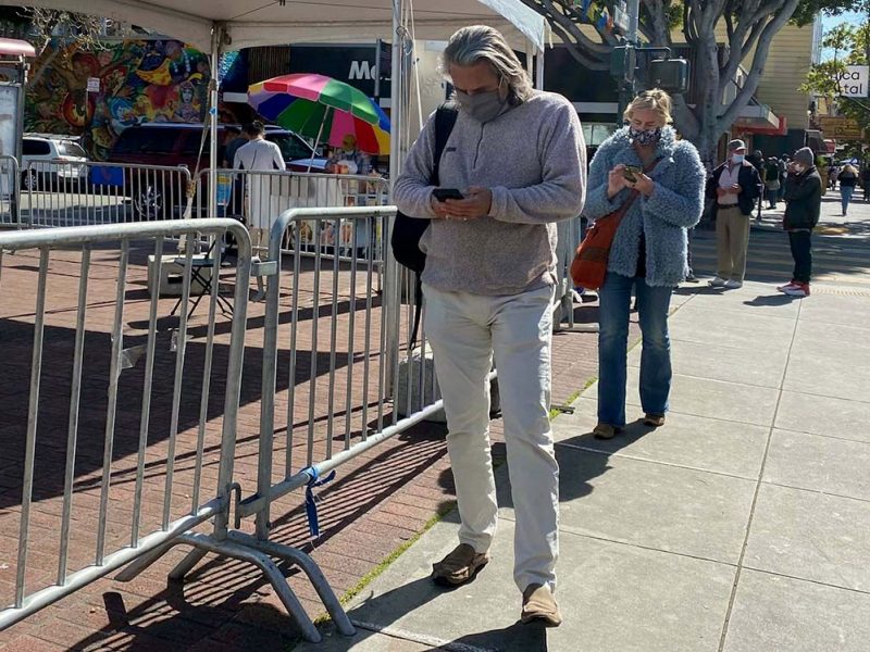 Waiting in line at 24th Street and Mission. Vaccination appointments can be made at the testing site.