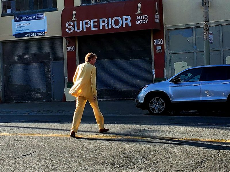A man in a yellow suit.