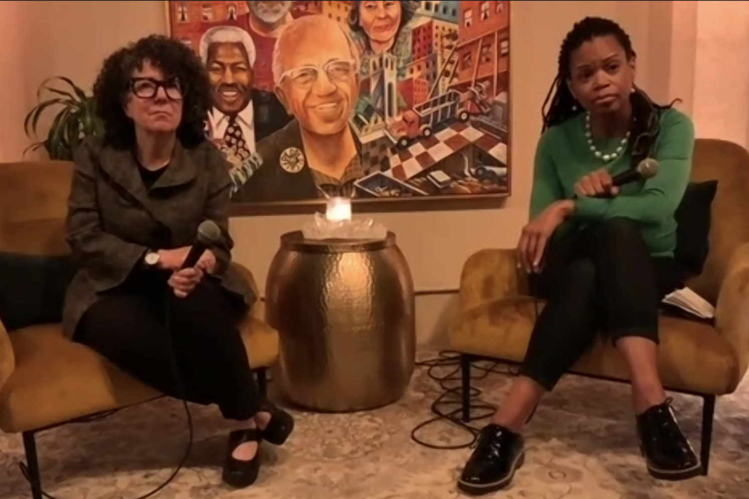 Dr. Kunins sitting in chair answering questions from audience at Manny's on Oct. 26