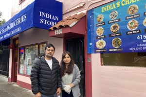 Dhruba Kunwar and Mina Banstala stand in front of the Indian grocery and chaat restaurant next door on 22nd Street.
