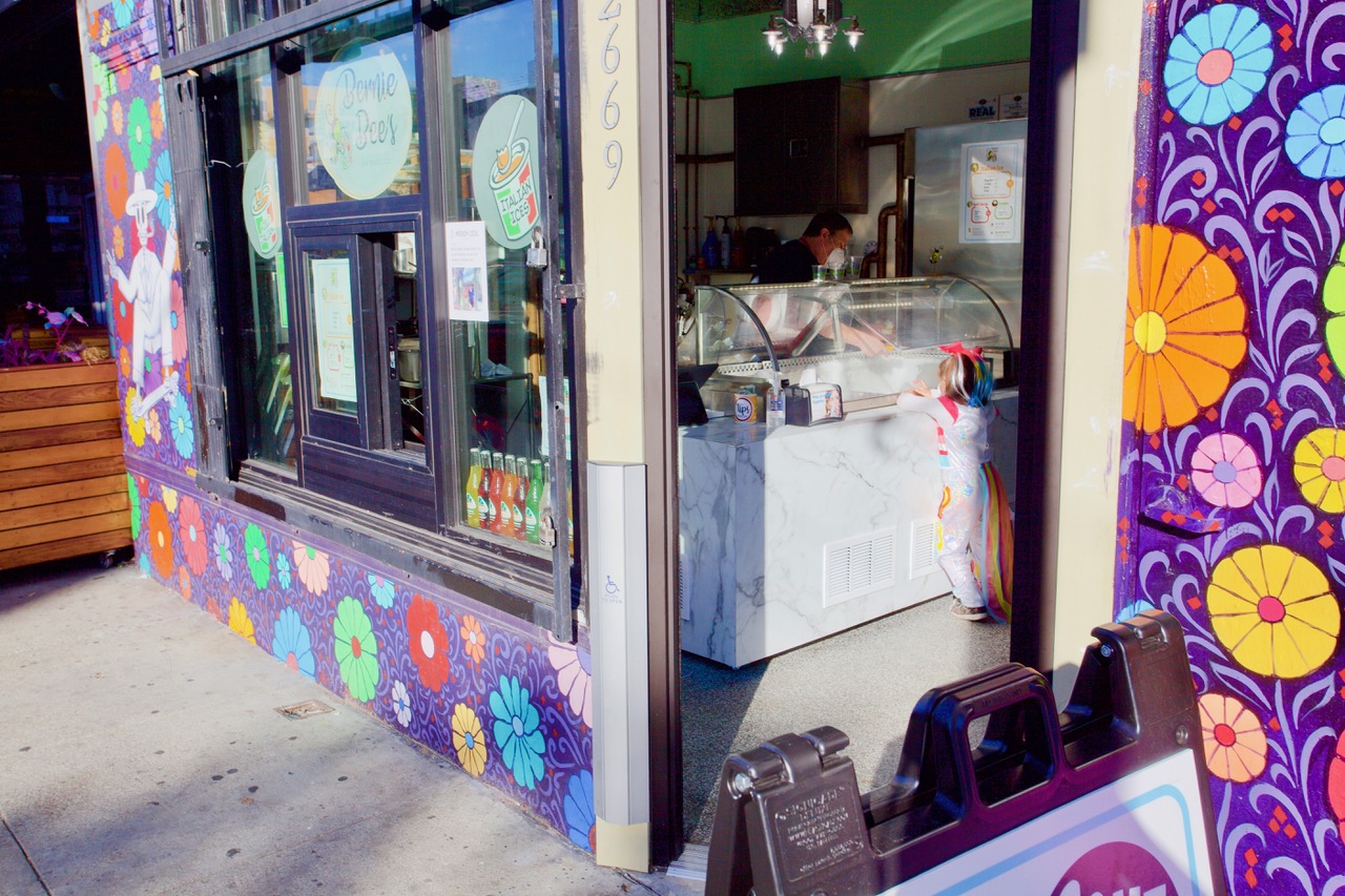 Girl in a unicorn costume at Bernie's Bees on Mission Street