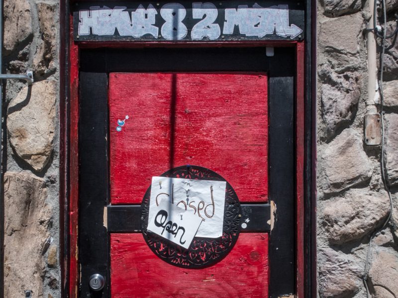 Closed open sign at Heavy Metal Bike Shop on 29th Street