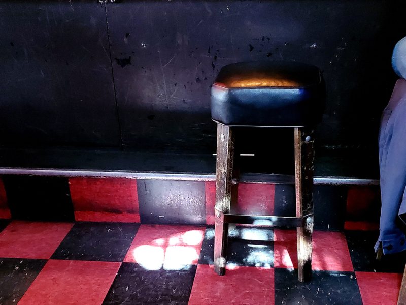 Bar stool at Delirium with sunshine coming in.