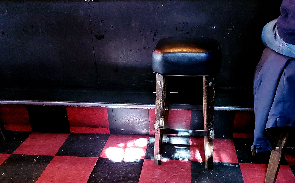 Bar stool at Delirium with sunshine coming in.