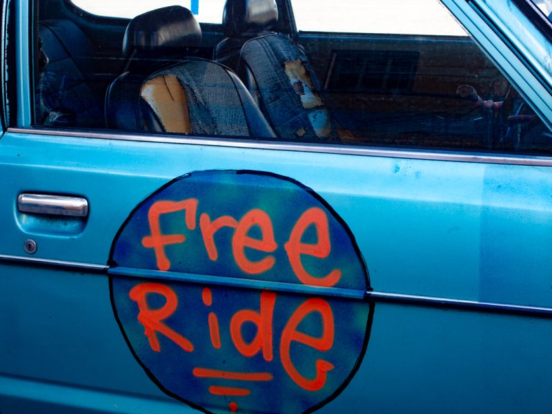 Photo with a Free Ride written on the car door.