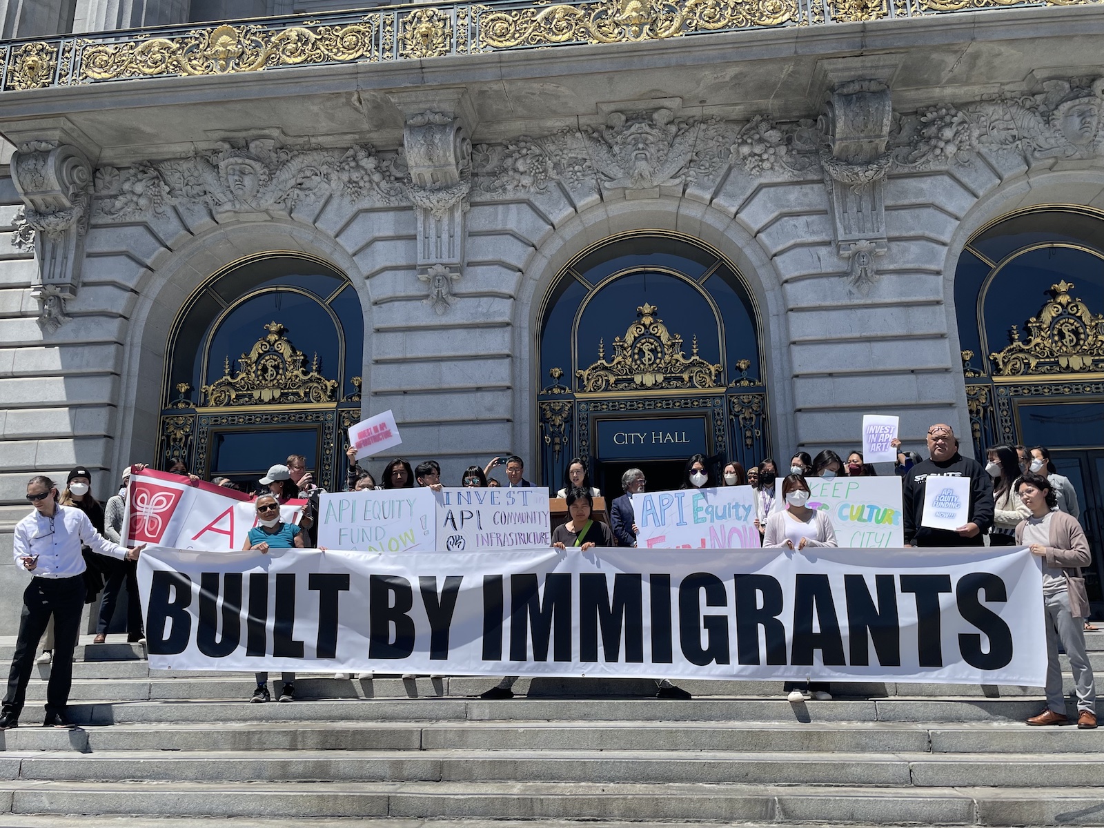 Connie Chan speaking at a press conference in front of City Hall to propose a $118 million investment plan.