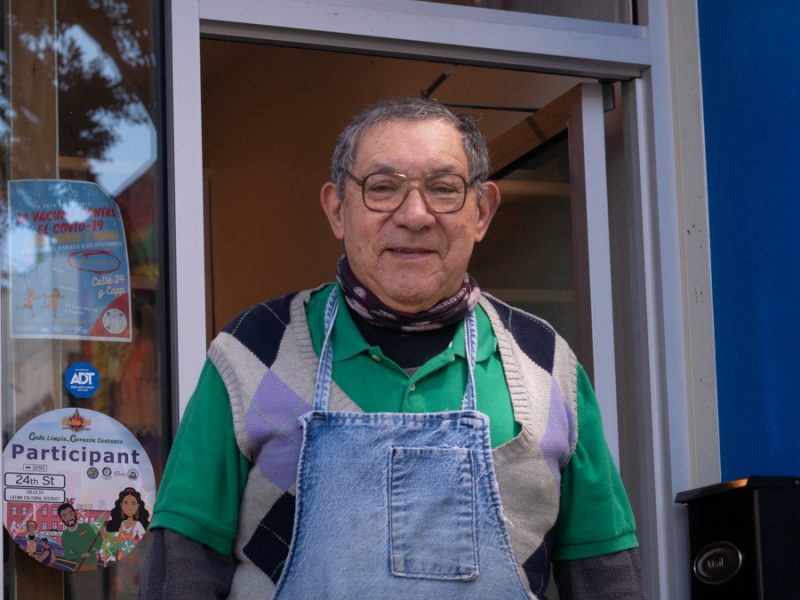 Jose Sanchez smiles in front of his diamond setting and jewelry repair store.