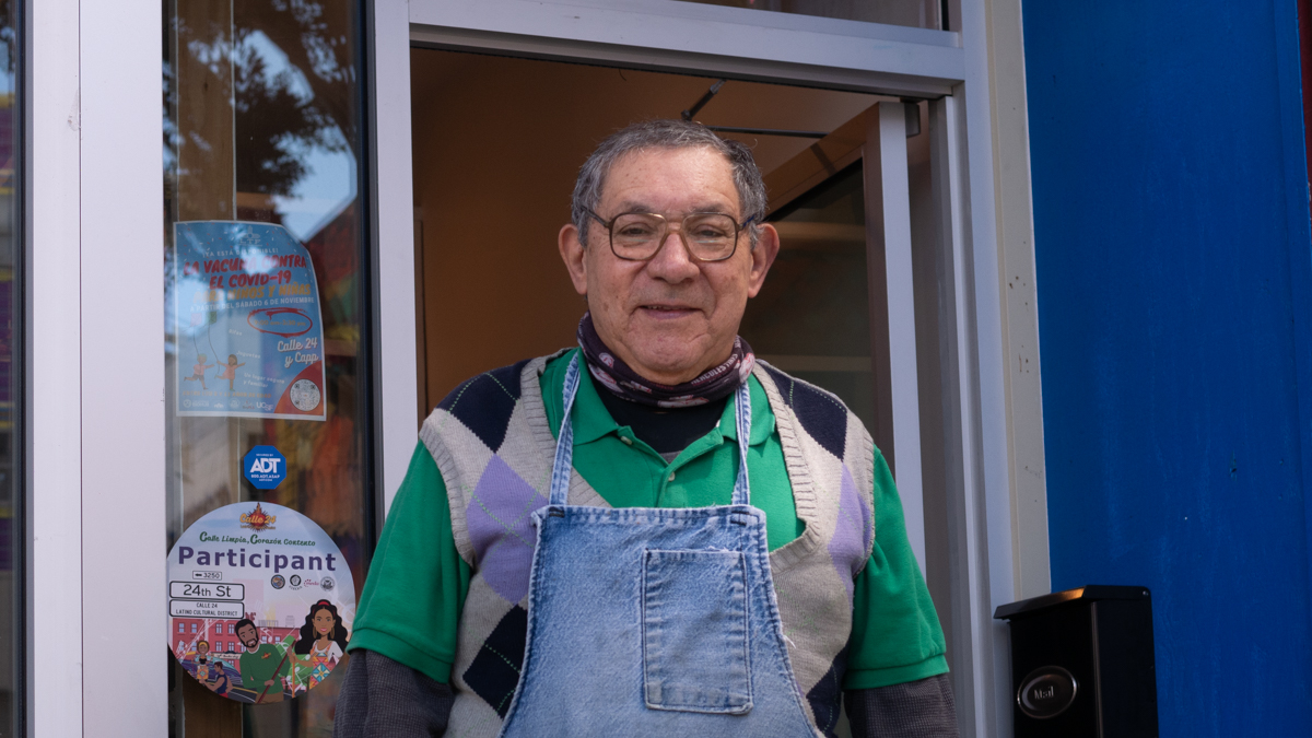Jose Sanchez smiles in front of his diamond setting and jewelry repair store.