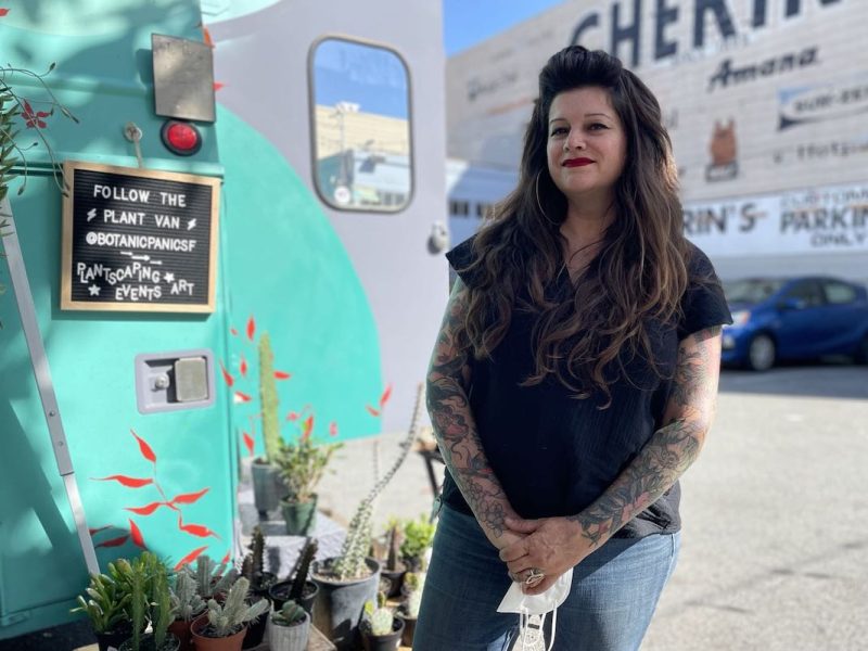 Amesia Doles in front of her van where she sells plants