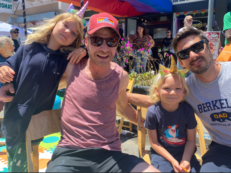 A family of four posing for a photo