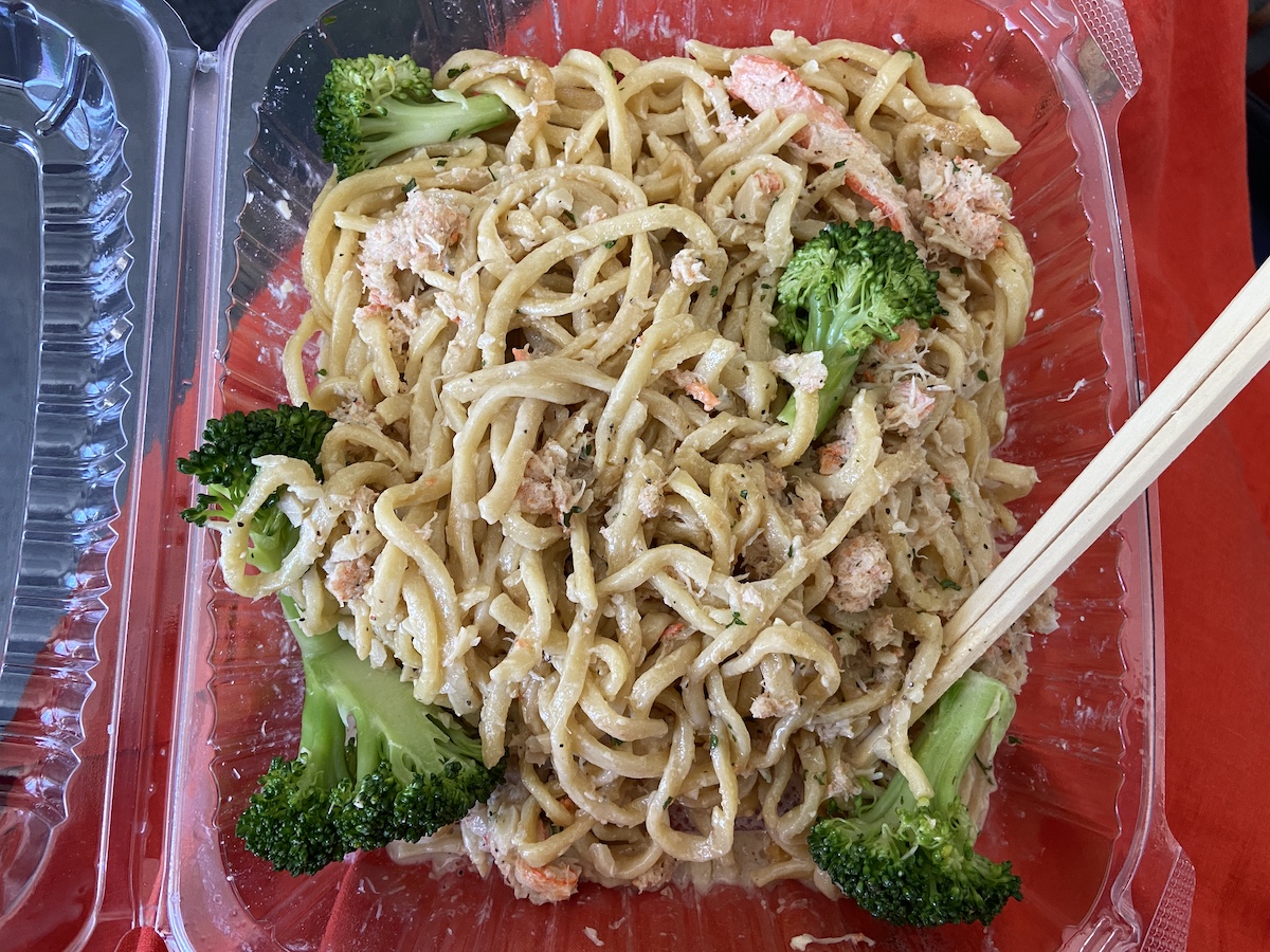 Crab and garlic noodles with chopsticks. Chic n' Time.