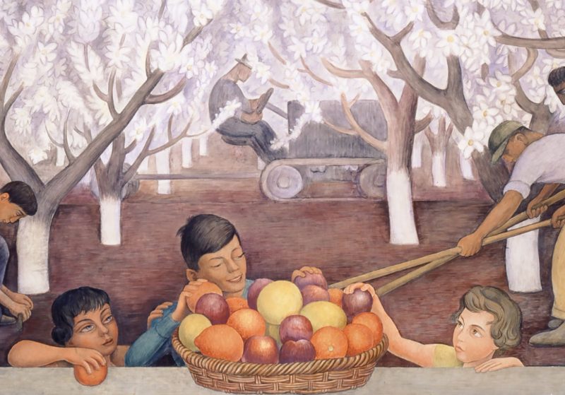 Diego rivera's painting, which features a group of kids gathered around a fruit bowl and blossom trees spread out in the background