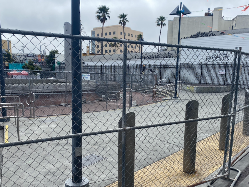 The temporary fence at 24th Street BART Plaza