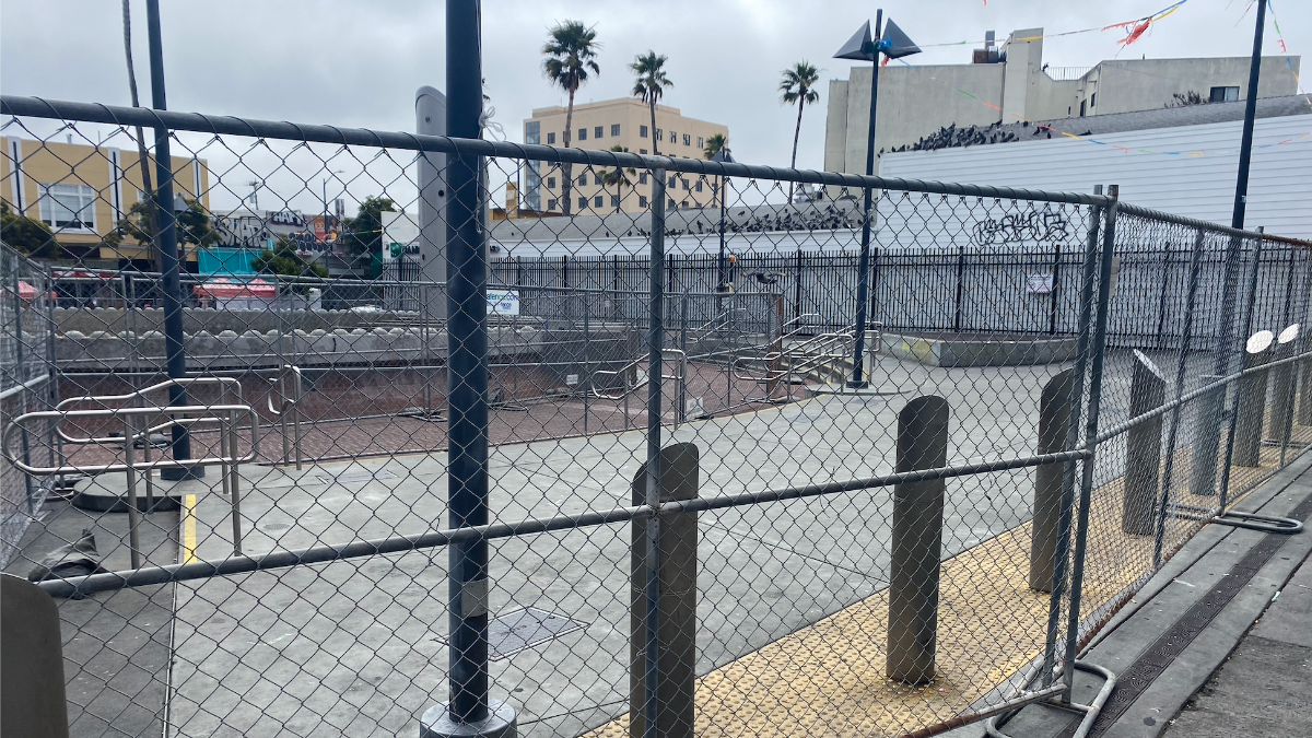 The temporary fence at 24th Street BART Plaza