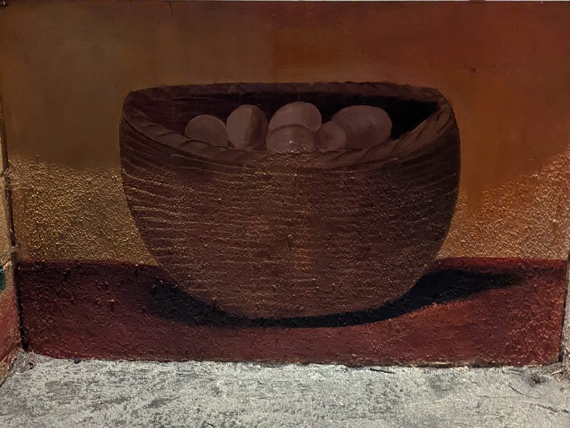 A mural of a basket full of eggs.