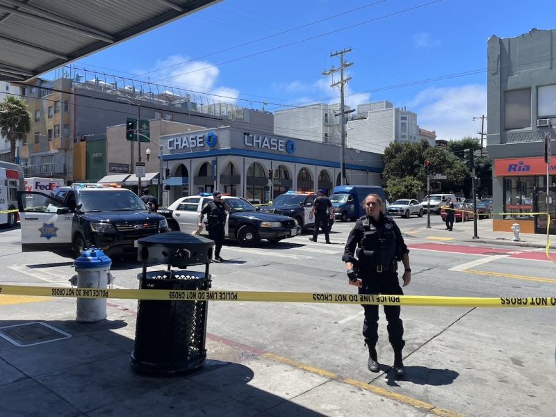 Police officers cordon off the area