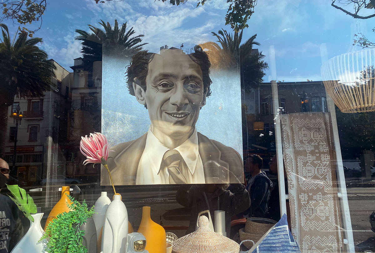 Photo of Harvey Milk in a window on Market Street