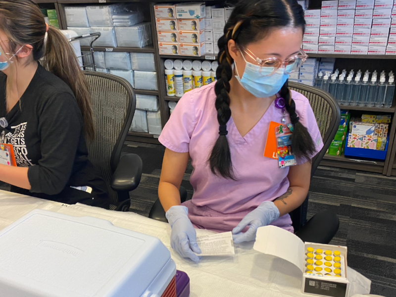 A nurse opens a monkeypox vaccine kit at SF General Hospital.