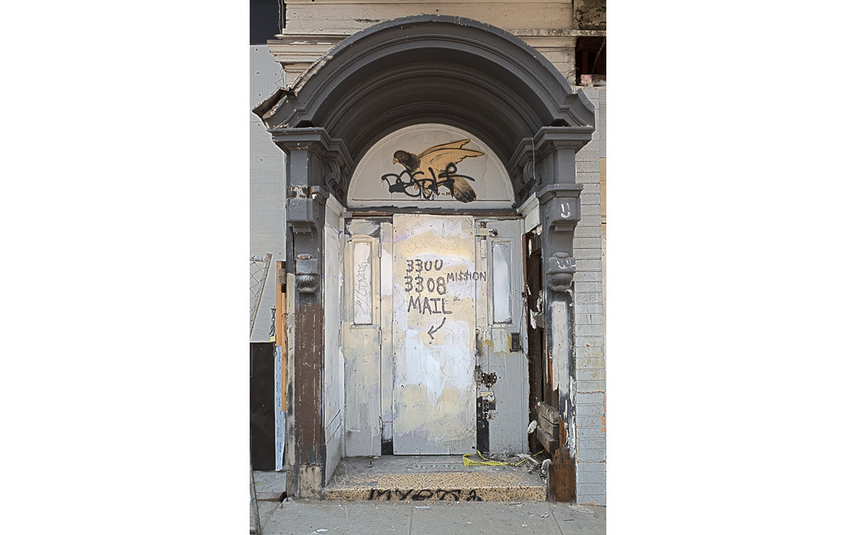 A door that has been boarded up.