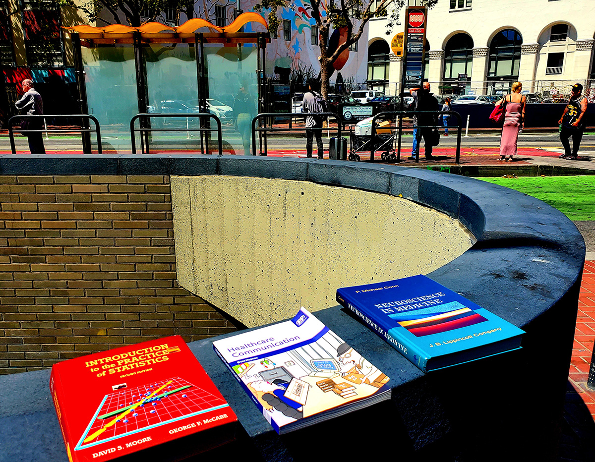 Books layed out on the rim of a transit entrance