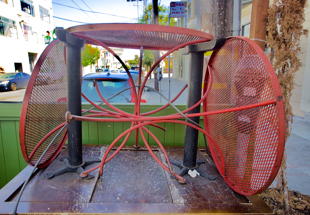 Three orange tables, two turned on their sides.