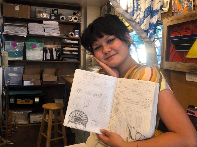 Abbylyn Roca shows her notebook. Photo by Chuqin Jiang.