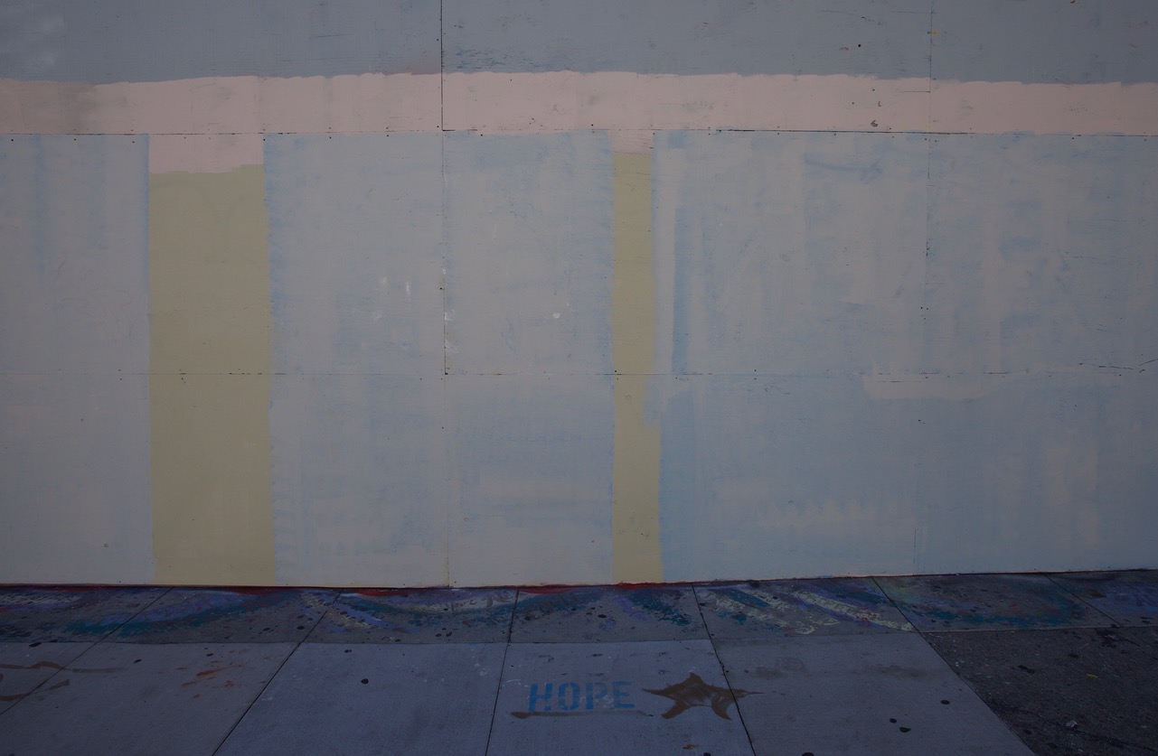 A sidewalk with the stencil: Hope