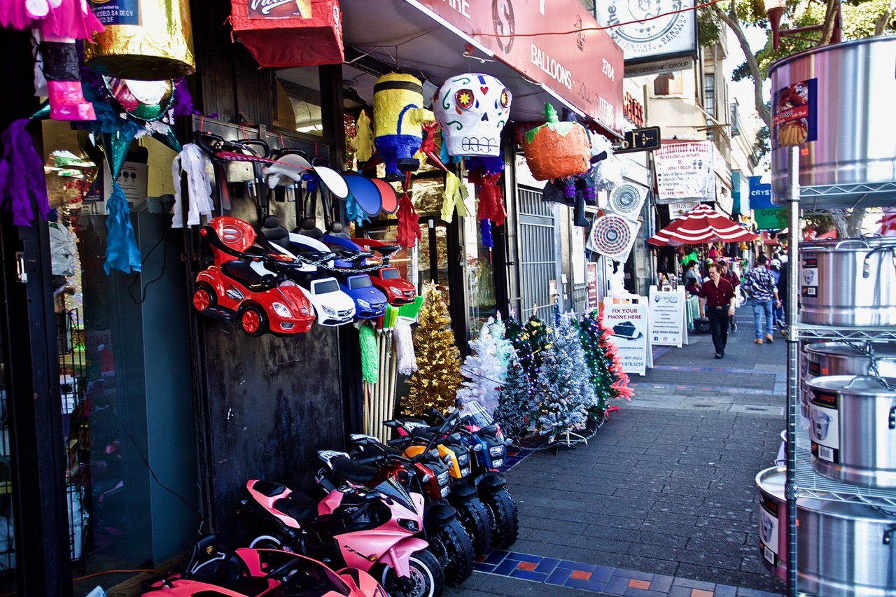 The outside of a store with loads of things for sale.