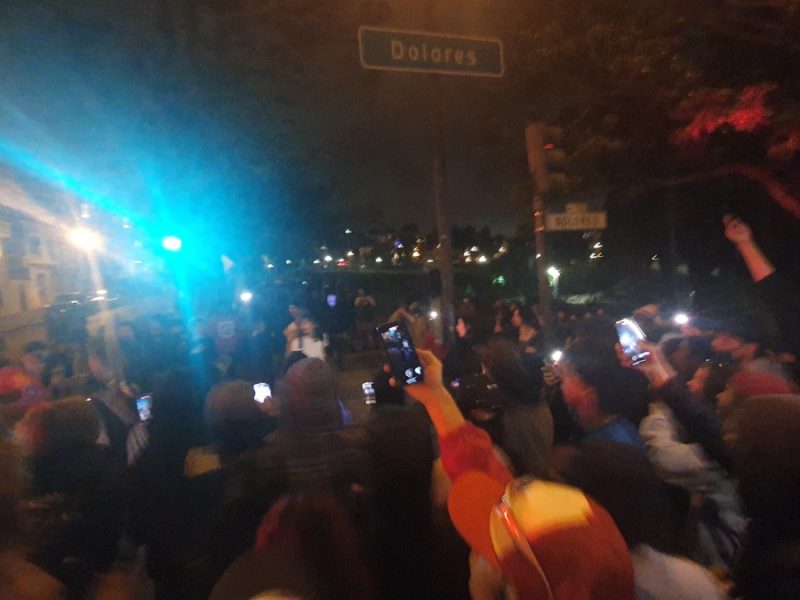Crowd reacts to fight next to Dolores Park