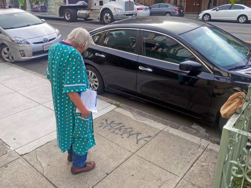 A woman looking at a tag.