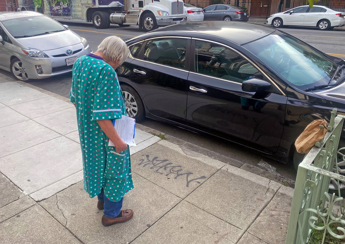 A woman looking at a tag.