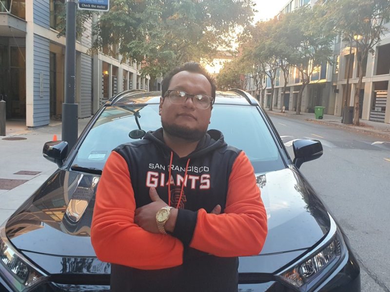 Miguel Vargas In Front of Car