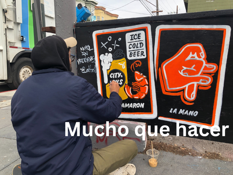 Max Martilla painting a mural